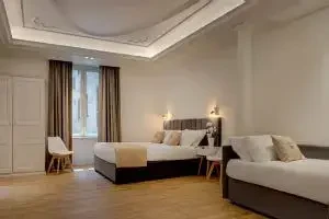 Camera del Boutique Hotel SM Vatican Relais con letto matrimoniale e letto aggiuntivo