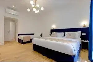 Camera del Boutique Hotel SM Vatican Relais con letto matrimoniale e letto singolo
